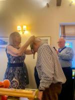 PP Angela presents President Robin with his gong